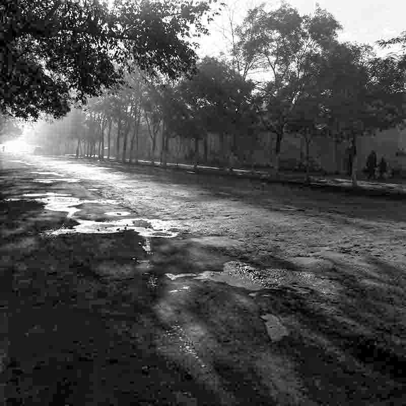 Oil-slicked street on the ancient Silk Road in the antique caravan city of Baku