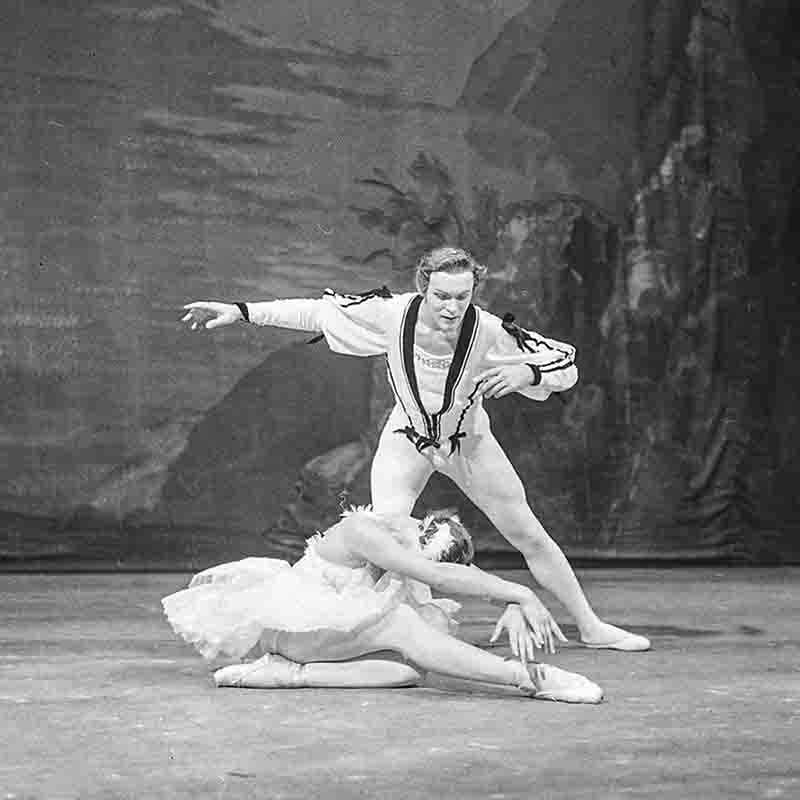 A black and white image featuring two Bolshoi Theater ballet dancers in an elegant pose, showcasing their grace and artistry.