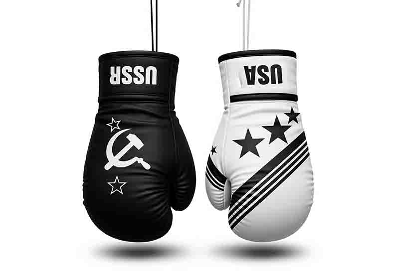 A stark, minimalist black-and-white digital illustration features two boxing gloves hanging side-by-side against a plain white background, symbolizing the Cold War rivalry.