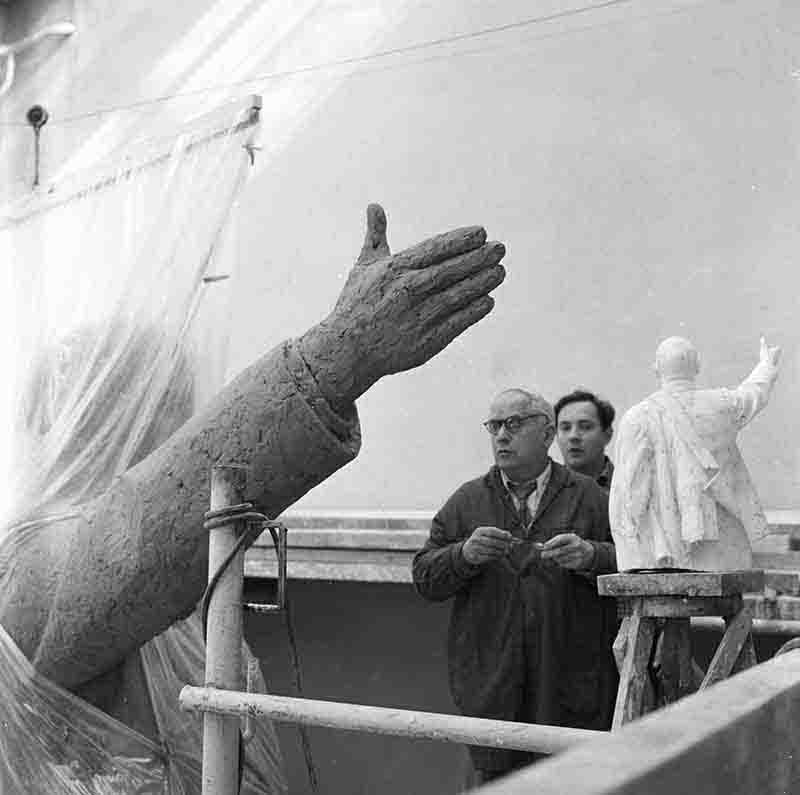 Sculptor Manizer and Assistant working on aLenin bronze statues in his atelier