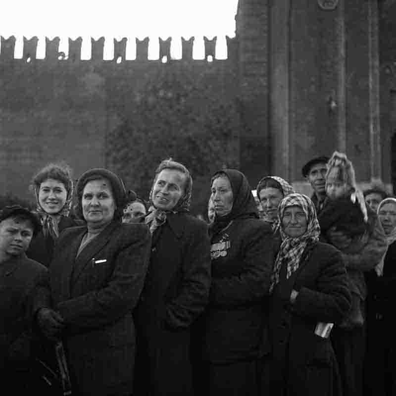 Highly decorated group of War Heroes Russia stands together in front of a textured wall